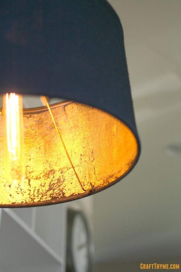 Completed gold leaf lampshade with edison bulb