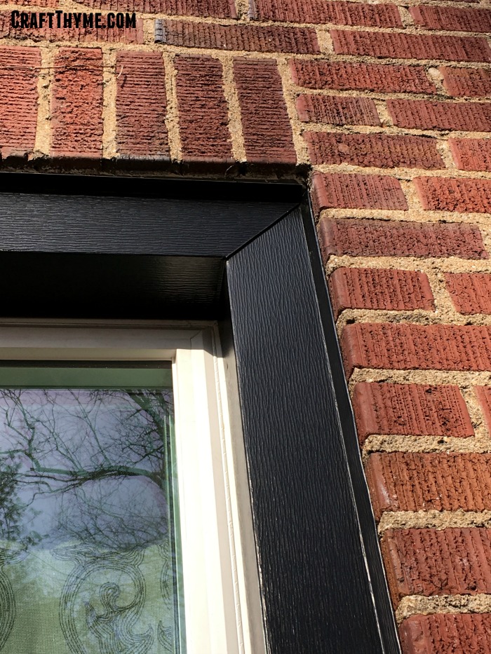 Mitered corners in plain frame metal capping.